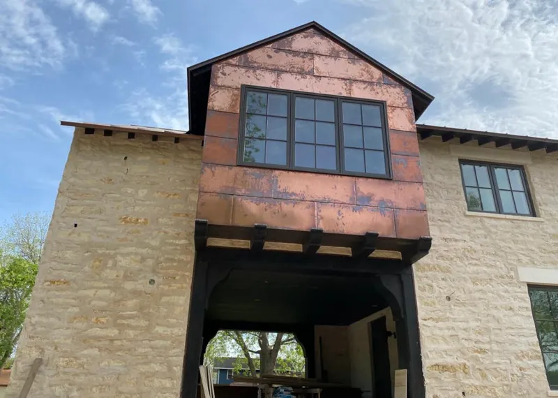 Copper metal panel facade on a stone building for Skylight Installation in East Windsor